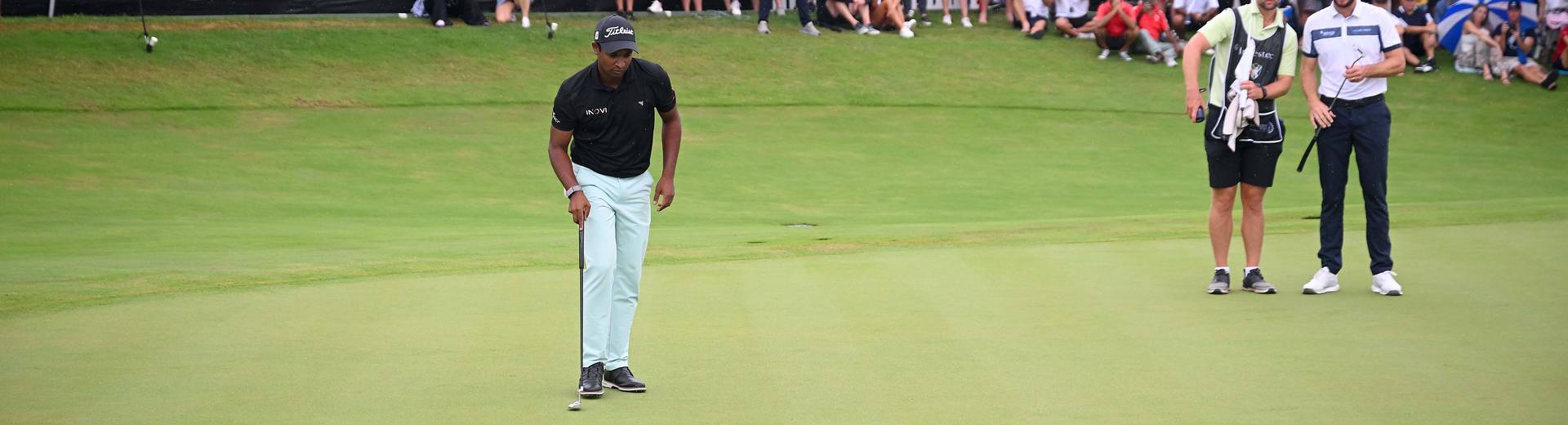 Dylan Naidoo lines up a putt during the Investec South African Open Championship in 2025.
